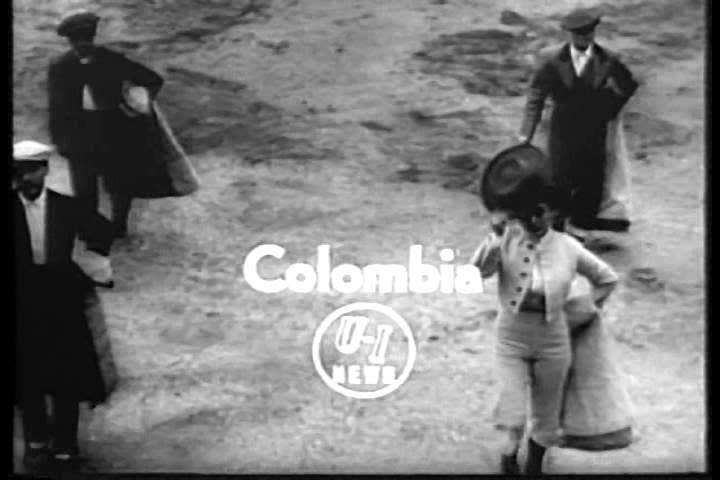 CIRCA 1950s - A 26 year old Colombian woman fights bulls in 1956.