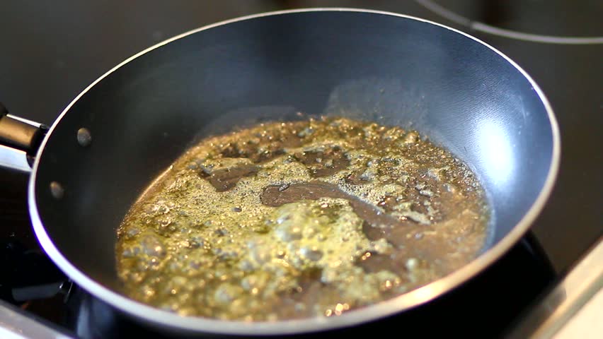 Egg and butter on frying pan