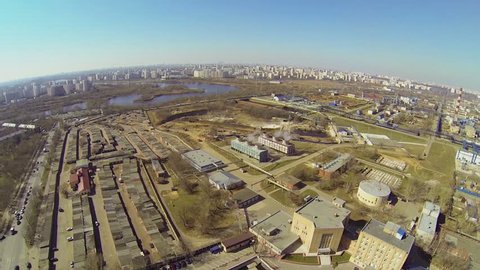 City panorama with oil refinery in sunny spring day. Aerial view