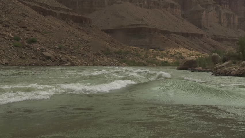 CIRCA 2010s - POV of white water rafting on the Colorado River in the Grand Canyon.