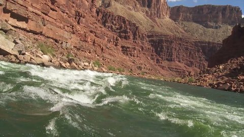CIRCA 2010s - POV of white water rafting on the Colorado River in the Grand Canyon.