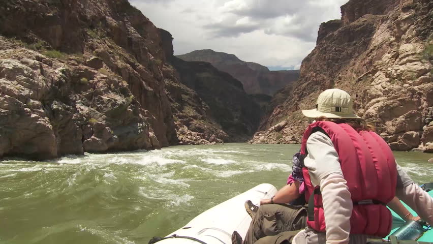CIRCA 2010s - POV of white water rafters navigate the Grand Canyon.