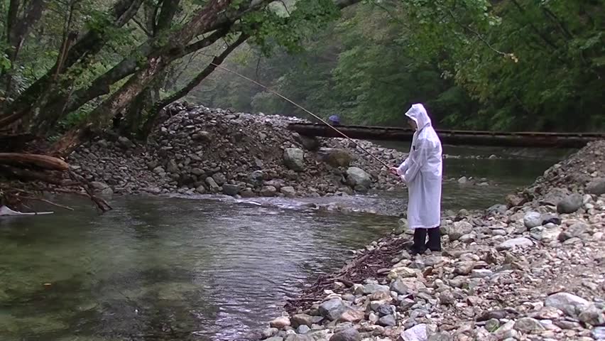 Young girl fishing on a rainy day