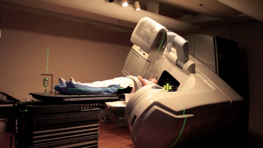 CIRCA 2010s - A patient is given radiation imaging treatment for a cancer diagnosis.
