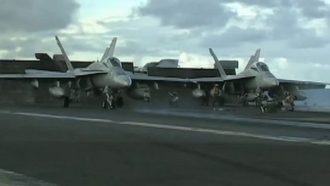 CIRCA 2010s - Jets land and take off from the deck of an aircraft carrier.
