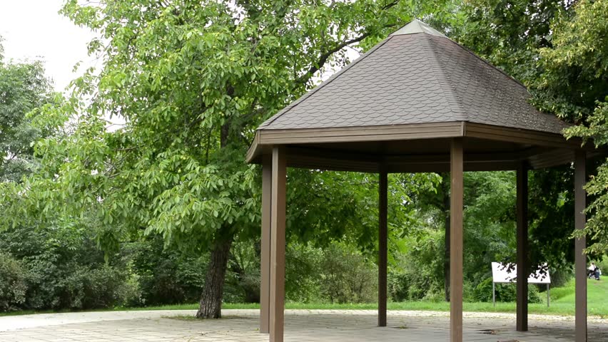 outdoor gazebo in the park - green trees