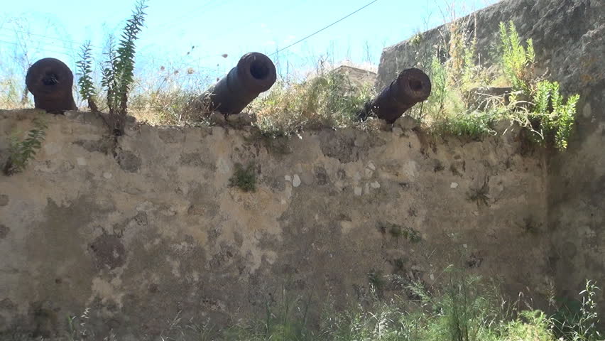 GREECE, LEFKADA ISLAND, JULY 12, 2014: AGIA MAVRA. MOORISH FORTRESS. Group of guns used for defense in medieval fortresses.