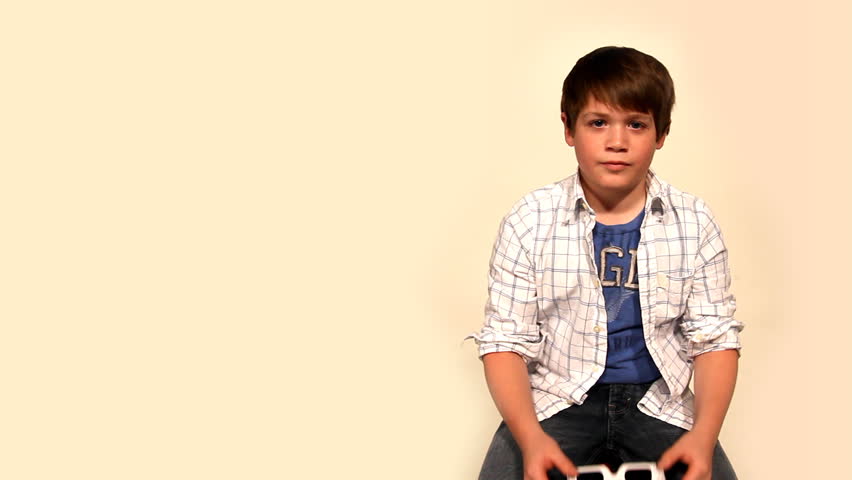 A young boy wears 3D glasses.