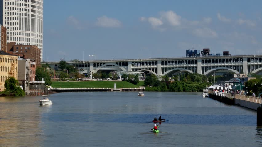 Boaters and kayakers on the Cuyahoga River near The Flats in Cleveland, Ohio.