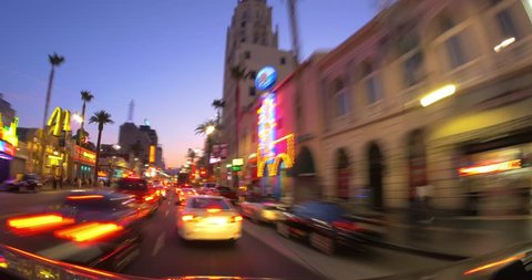 LOS ANGELES - June 23, 2014: POV driving up and down Hollywood Blvd at sunset. 4K UHD timelapse.