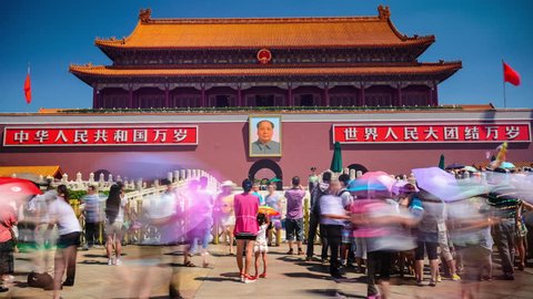 BEIJING, CHINA - JUNE 27, 2014: Tourists at the Tiananmen Gate at Tiananmen Square. 