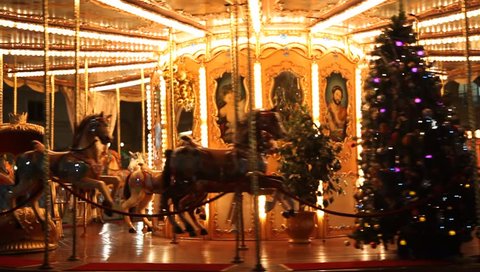 FLORENCE, ITALY - DECEMBER 23:  The city is decorated in the night before Christmas. Italian and world travelers enjoy traditional merry go round ride with Santa, December 23, 2009 Editorial Stock Video