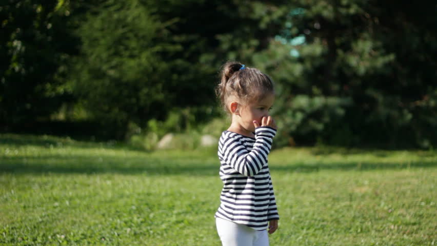 Beautiful child and green trees