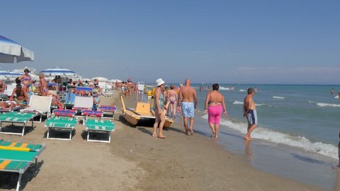 Riccione Beach, Italy, August 2014: Riccione is a main destination of tourism on the Adriatic riviera of Romagna, and, together with Rimini, is one of the best known seaside resorts in Northern Italy