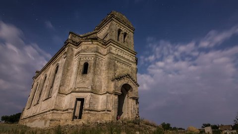 Timelapse of an old ruined church of St. George with a starry sky and star-trails on a background. An old church was constructed in 1900 and located in Odessa region, Ukraine.