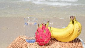 Tropical fruits on the sandy beach 