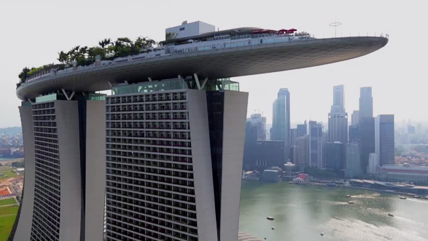 Aerial view of Marina Bay Sands revealing Singapore City Skyline in the background, Feb 2014 Royalty-Free Stock Footage #7181200