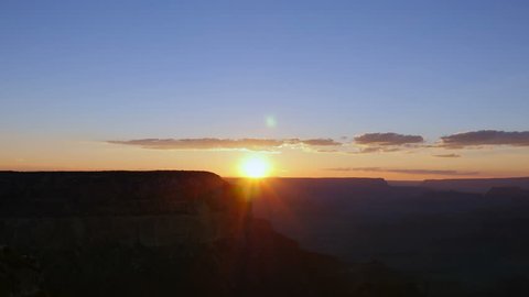 Thin layer of clouds and beautiful glow after sunset at the Grand Canyon. 4K UHD timelapse.