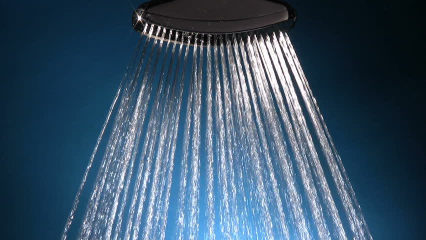 cool, clean water streams down from a shiny metal shower head, shot in studio,