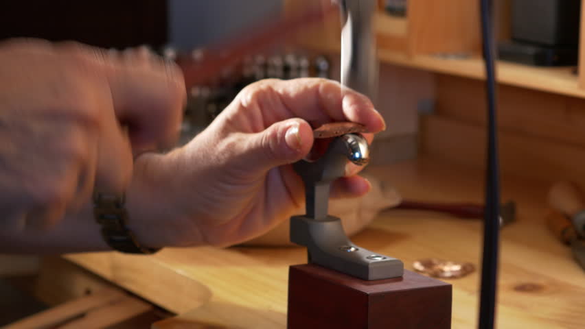 4k Video of hands hammering and sawing metal, Artist working in studio.