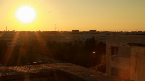 Beautiful Sunset Flare From A Top Of A Building, Aerial, Sky, Sun, Apartment Pan