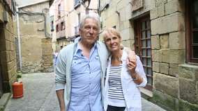Senior couple visiting northern spanish town