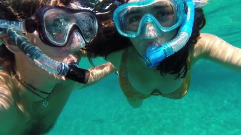 Couple doing snorkeling in the Adriatic sea