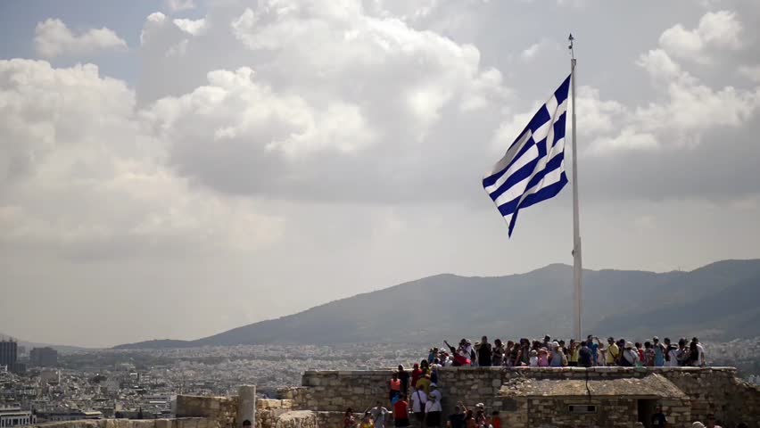 Greek flag in the Acropolis on the hilltop in Athens, Greece.
