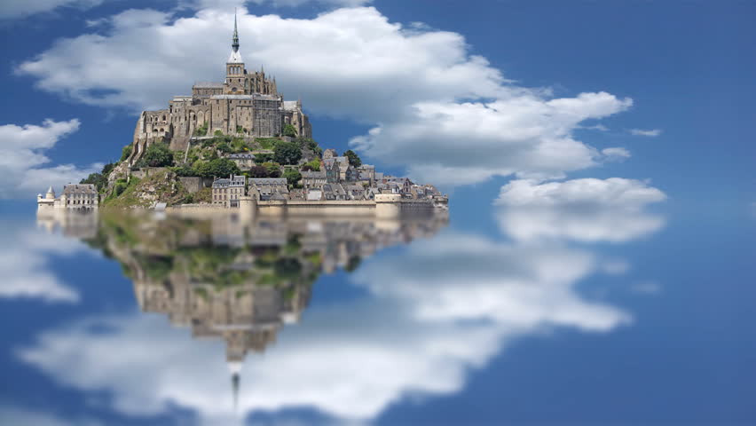 Le Mont Saint Michel, an UNESCO world heritage site in France, with timelapse sky