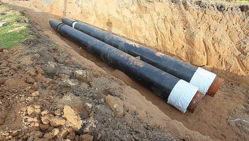 Metal plumbing pipes in insulation in the ground laying deep | Shutterstock HD Video #7204147