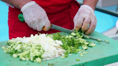 Chef Chopping Vegetables. Chef at work in restaurant kitchen.
Chef Chopping Salad Ingredients.