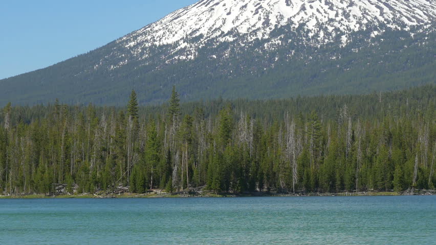 Zooming out view of Mount Bachelor with Little Lava Lake in the foreground, then pan left to Broken Top.