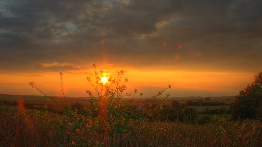 Warm sunset over fields, motorized time lapse clip, high dynamic range imaging