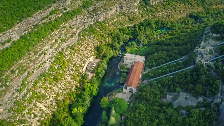Copter aerial view to the Miljacka Hydroelectric Power Plant which is located on the Krka river 15 kilometers downriver from Knin. Miljacka is one of the oldest active power plants in the world.