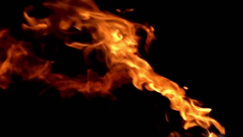 Flames on a Black Background. Fire ignites a stream of flammable liquid on a black background. Slow Motion at a rate of 480 fps