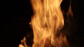 A looping clip of a fireplace with medium size flames