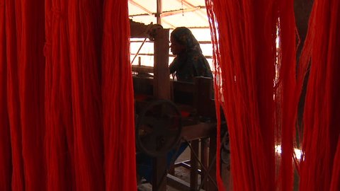 BANGLADESH - Aug 2010: Girl working in garment factory
