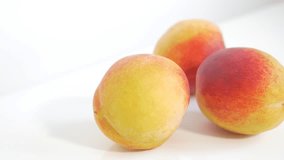 Peaches tasty fruit UHD 4k footage panning on white background - Juicy peach on white background 3840X2160 UHD fruit video