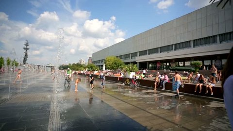 MOSCOW, RUSSIA - CIRCA AUGUST 2014: Children enjoy dancing fountains at the Muzeon art park. Muzeon is a park in the center of Moscow. Located on the waterfront of the Crimean.