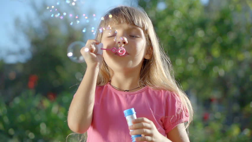 Cute Little Girl Is Blowing Stock Footage Video 100 Royaltyfree