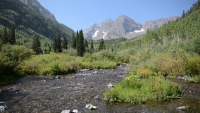 Maroon Bells with stream flowing, Elk Range, Colorado. HD Video