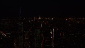 Aerial view of New York City at night. Shot from helicopter over New York City State, Manhattan and all iconic NYC landmarks.