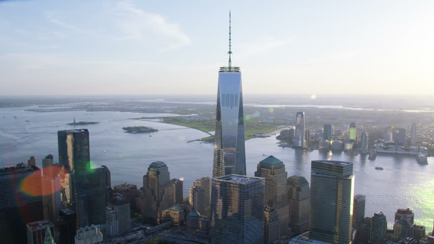 Aerial view of the One World Trade Center known as the Freedom Tower at Ground Zero in Lower Manhattan, New York City. Flying over the Iconic skyscraper and the Financial District. Royalty-Free Stock Footage #7243840