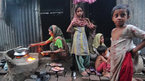 BANGLADESH - Aug 2010: Familes in slums cook outdoors