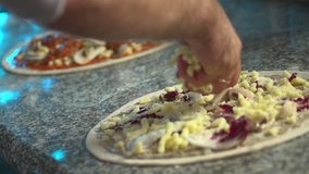 Stock video footage cooking pizza sprinkling of cheese pizza