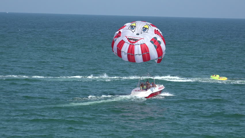 VARNA, BULGARIA - AUGUST 1, 2014: Balloon, parachute over the sea. Shot in 4K (ultra-high definition (UHD)), so you can easily crop, rotate and zoom, without losing quality! Real time.
