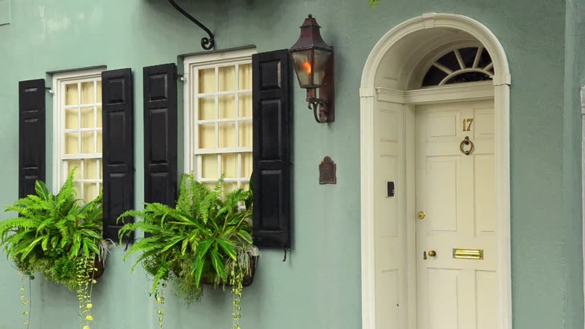 Charleston South Carolina Tradd Street old homes with color and flowers doorways and torch light