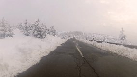 snowy mountain rural road drive POV, gopro- Stock Video