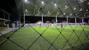 THAILAND, KOH SAMUI, 16 july 2014 Soccer players on the field at night with lighting
