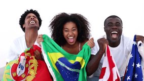 African-american football fans in white sitting on couch holding flags on white background - Powered by Shutterstock - Get 15% off with code: PIKWIZARD15